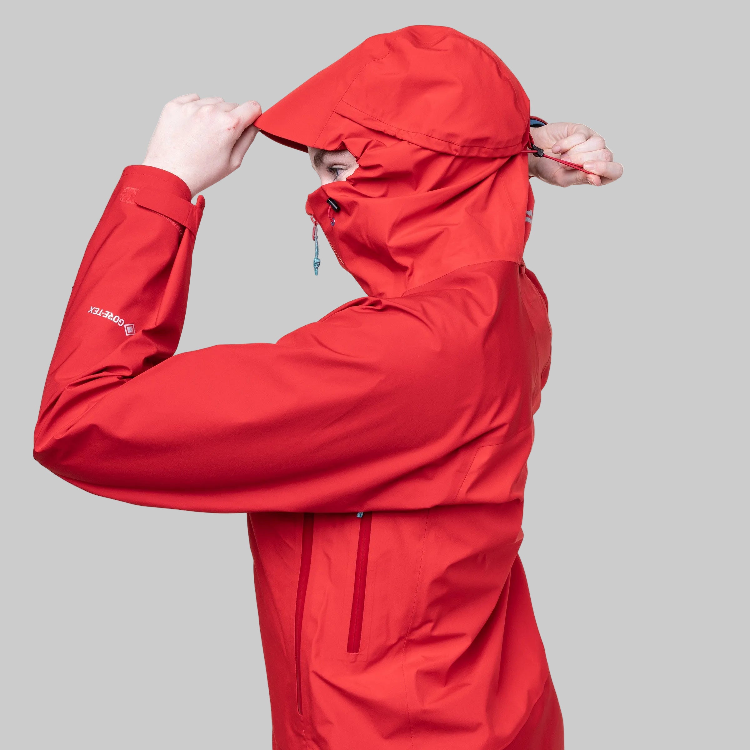 Red raincoat with a hood on a white background