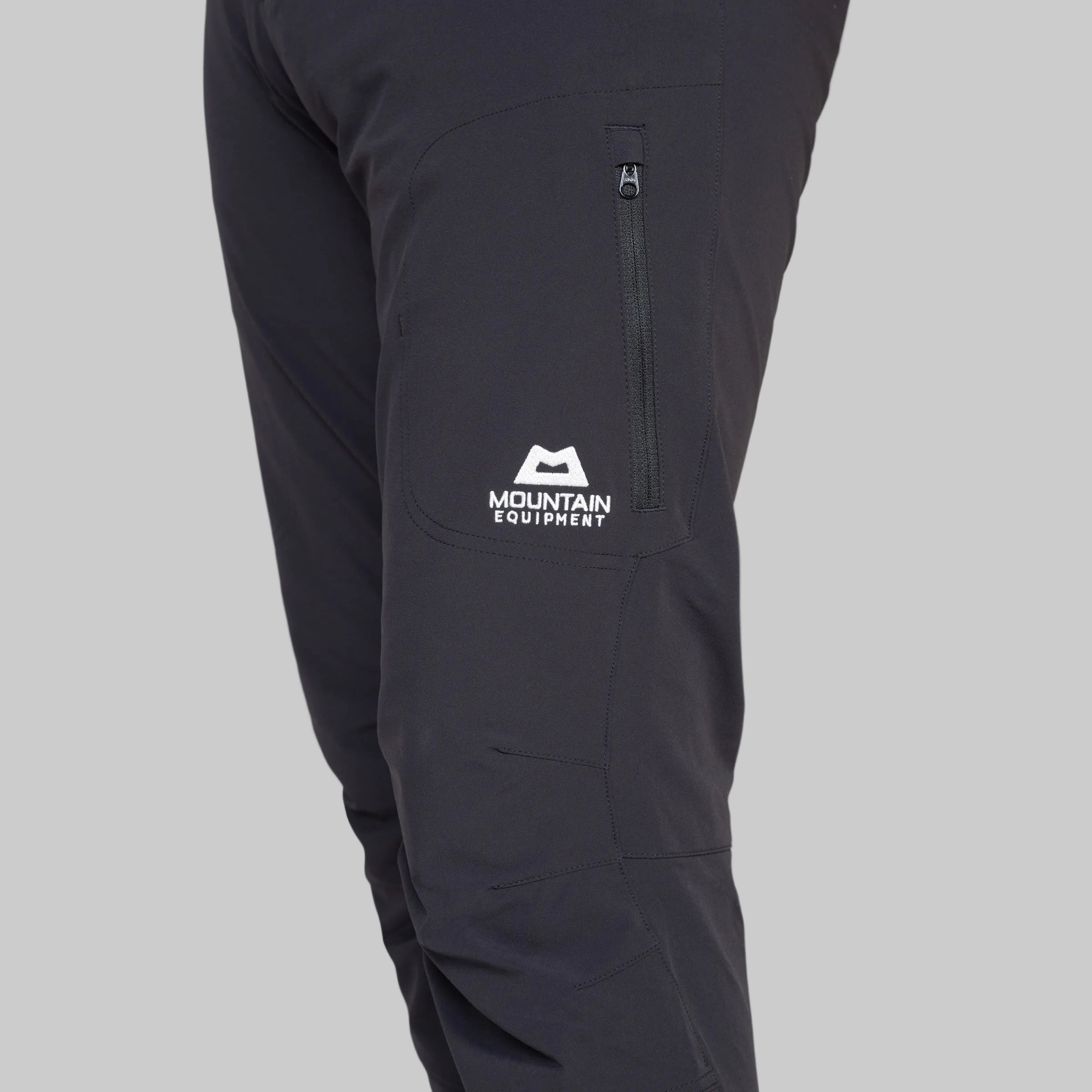 Black pants with a visible brand logo on a white background